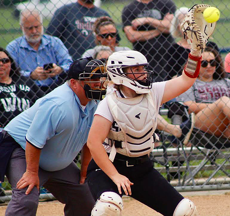 SPARTA'S MADELINE BROWN reaches for a pitch.