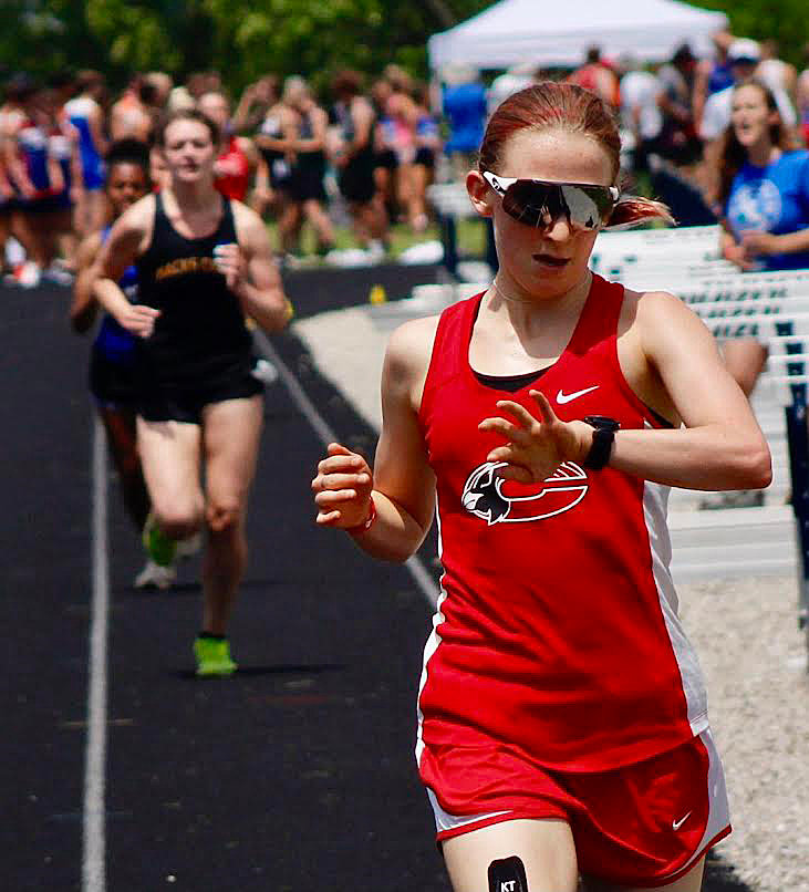 CHADWICK’S GRETCHEN HOUSE checks her time upon winning the 1,600 in Class 1 Sectional 4 action Saturday.