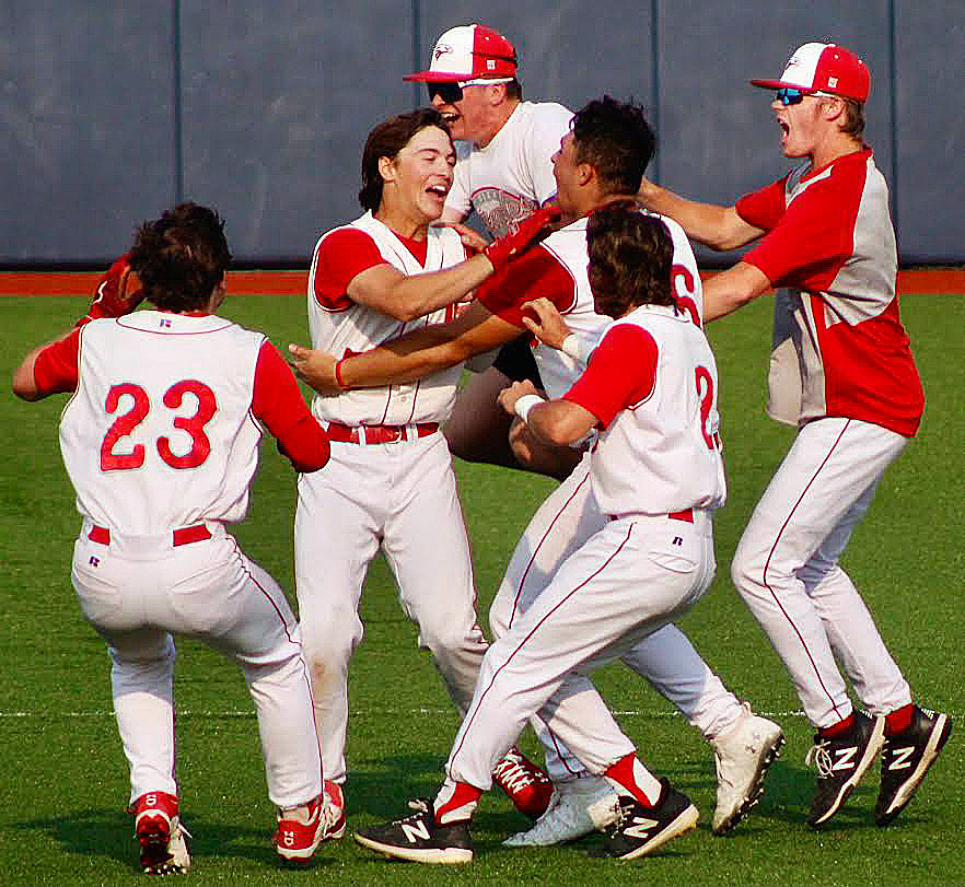 NIXA'S SAM RUSSO is met by teammates following his game-winning RBI single in the Eagles' 5-4 win versus Republic on Tuesday.