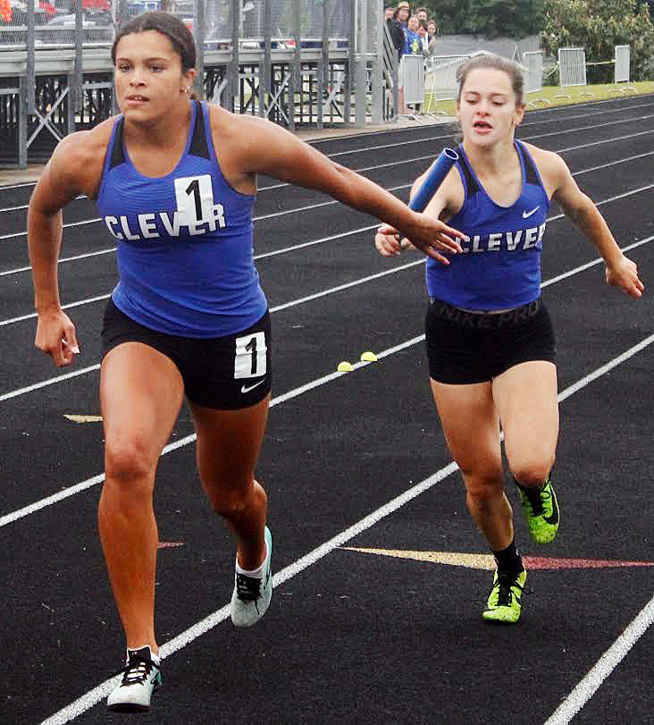 CLEVER’S MILEYA CLARK receives the baton in the 4 x 200 relay.