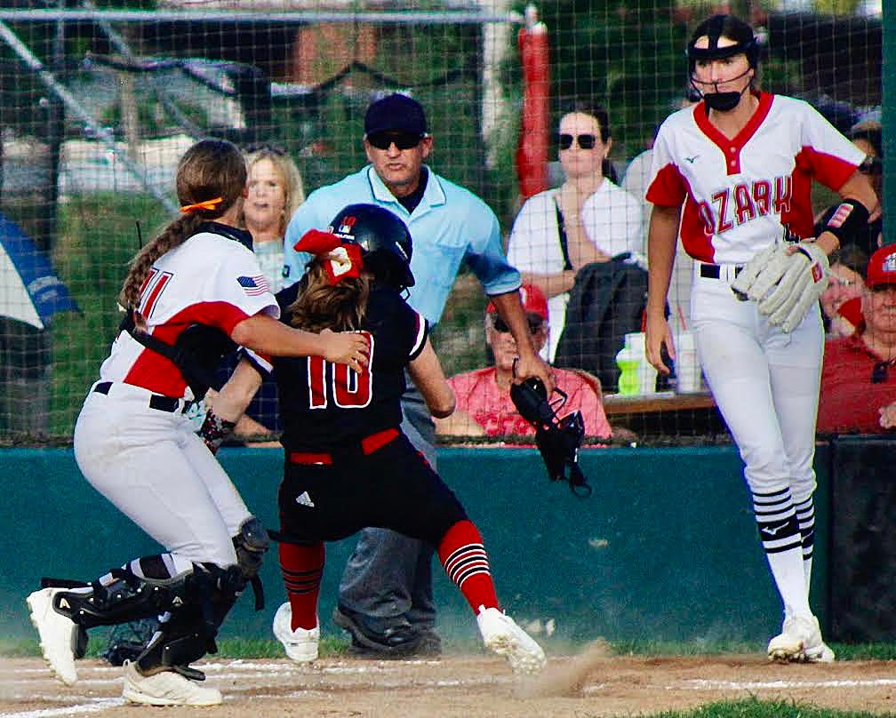 OZARK'S NATALIE MORGAN tags out a Branson runner at the plate Tuesday.