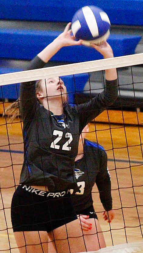 CLEVER'S MACKENZIE CAMP tips the ball over the net in the Lady Jays' win at Billings on Tuesday.