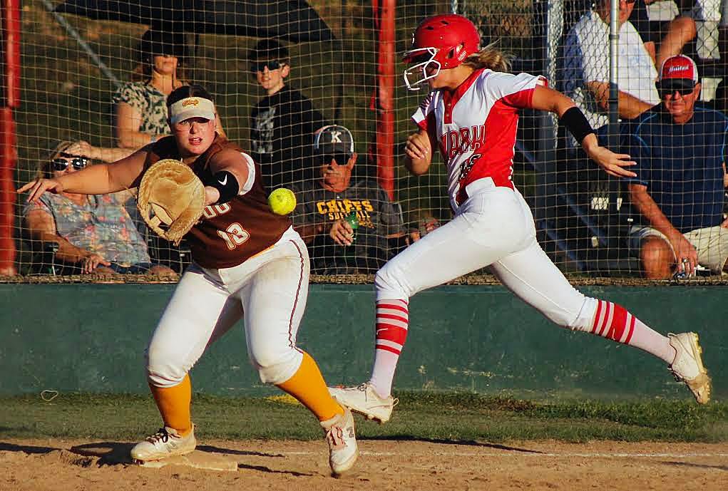 OZARK'S BROOKLYN HASLER tries to beat a throw to first base.