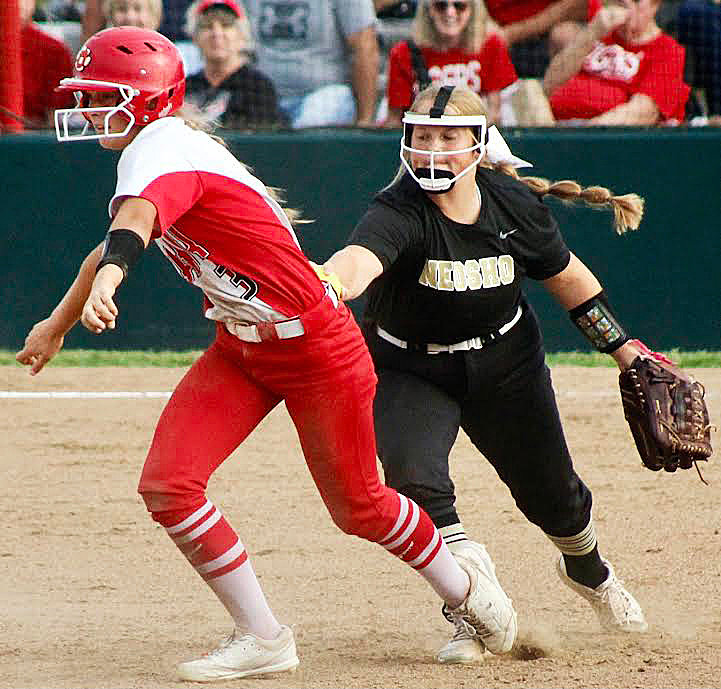 OZARK'S KELSIE BATEY is tagged out trying to get back to second base.