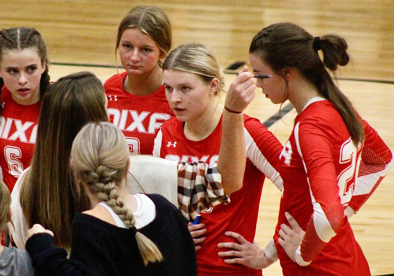 NIXA'S JACY BRAY, middle, listens to instructions from coach Annie Zimmerman.