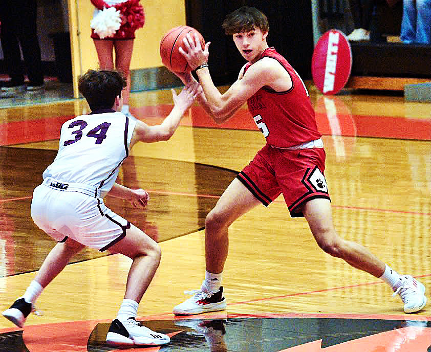 OZARKS HUDSON ROBERTS brings the ball upcourt against Rolla at the Republic Tournament last week.