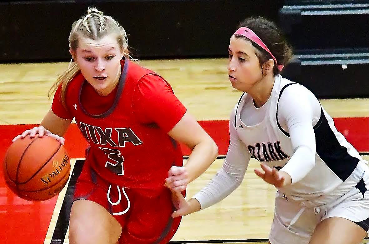 NIXA'S JACY BRAY drives along the baseline.