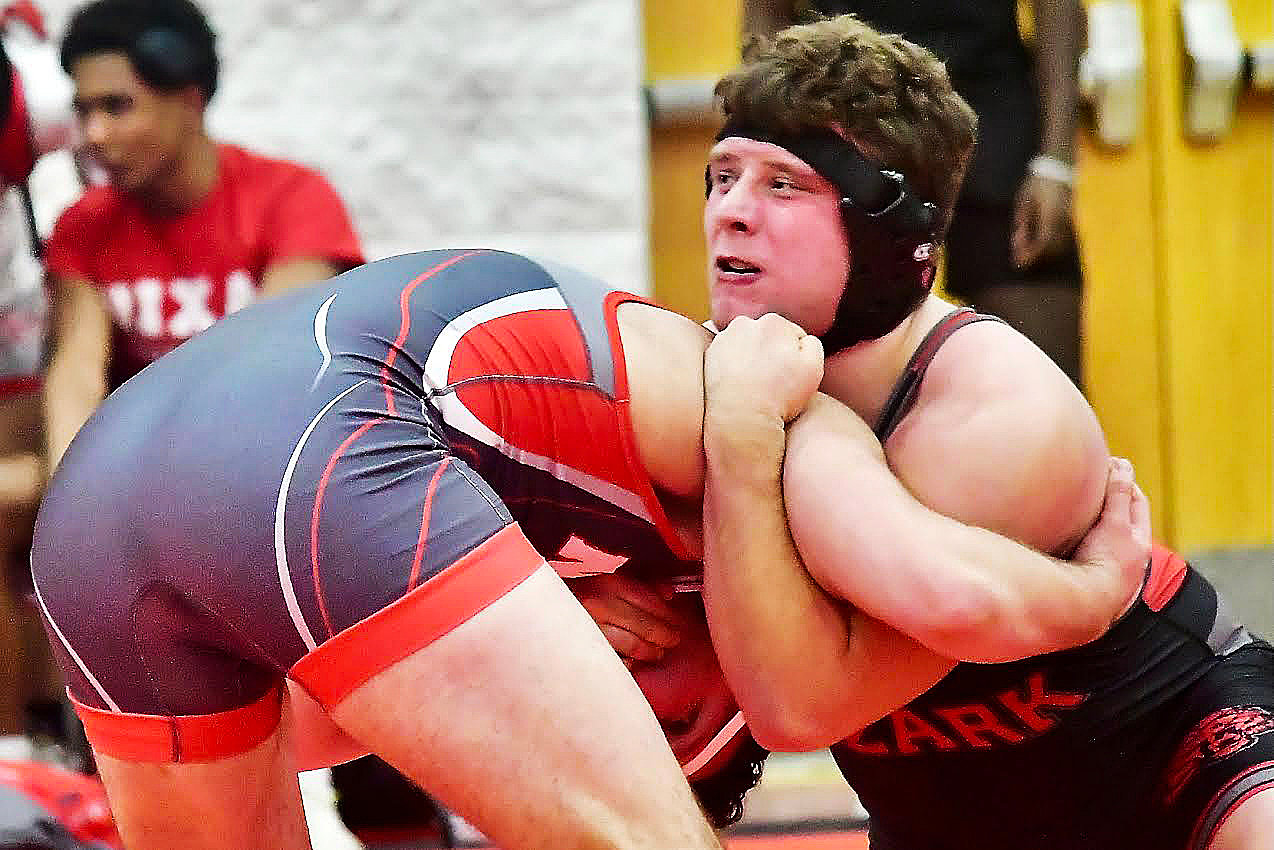 OZARK'S PEYTON GREER has the upper hand on Nixa's Charles Speake in their 285 bout Tuesday.