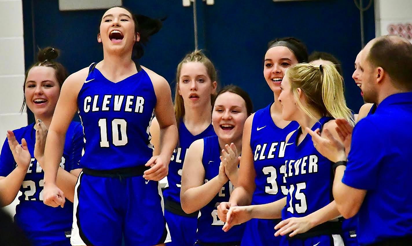 CLEVER'S IRELAND JONES and her teammates celebrate their Marionville Tournament championship Saturday.