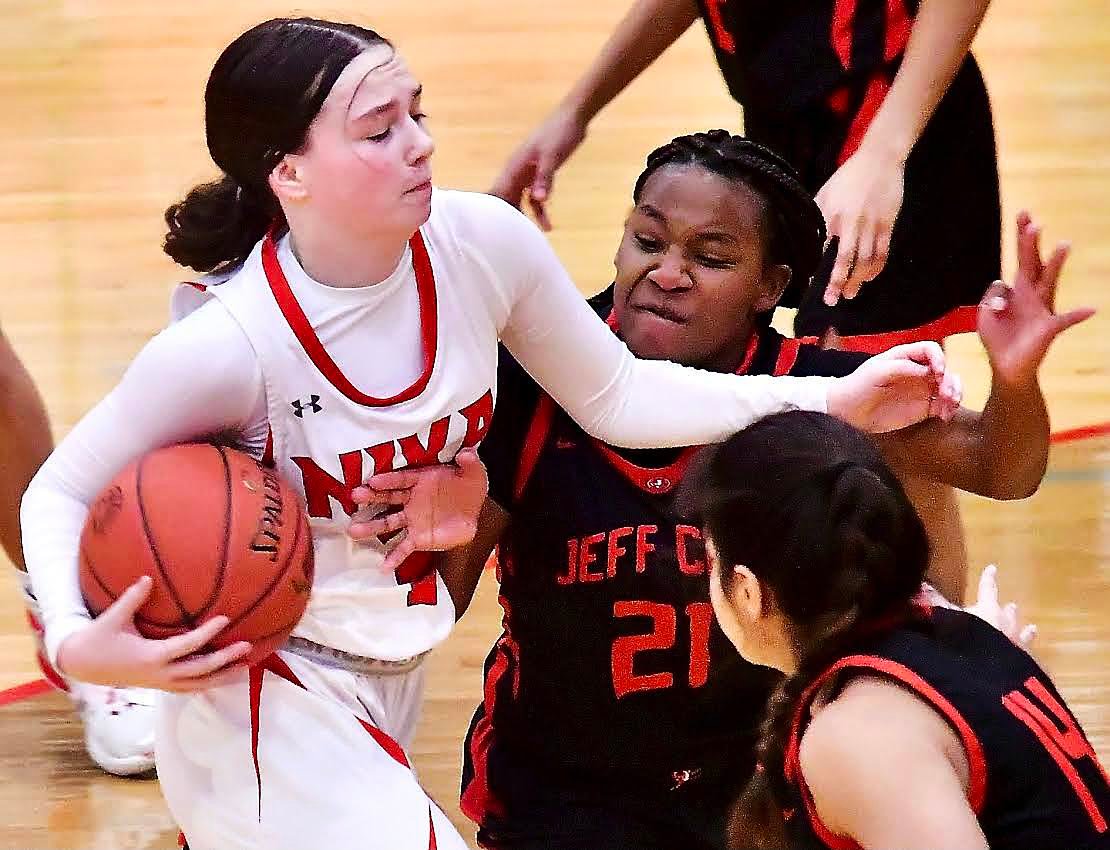 NIXA'S LILY MAHY goes strong to the bucket.