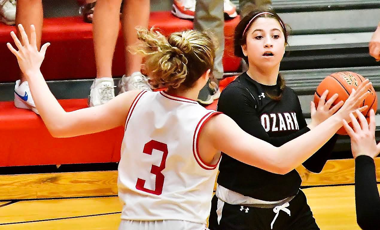 OZARK'S KORI ROUSSELL scans the court at Branson on Monday.