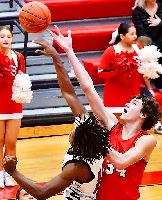 OZARK'S COHEN GEORGE battles for control of the opening tip.