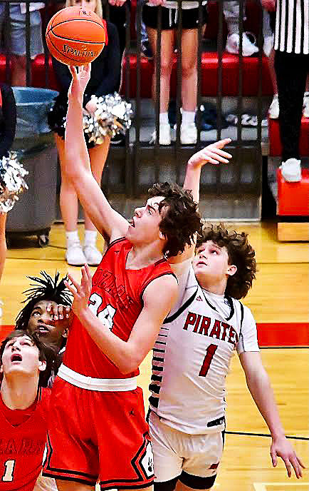 OZARK'S COHEN GEORGE reaches for the ball.