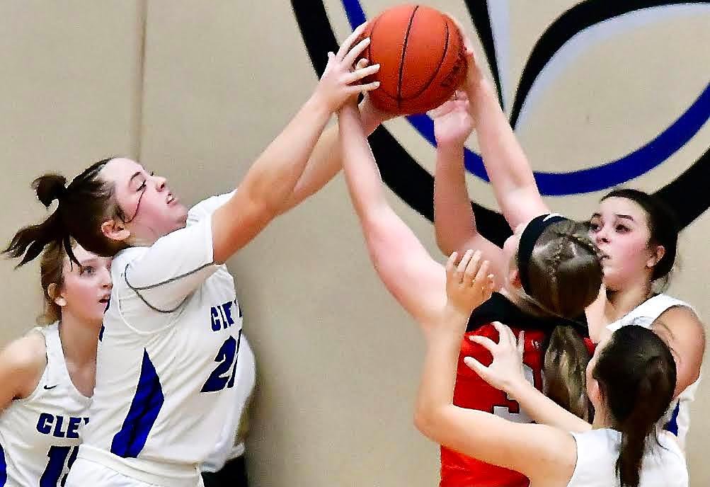 CLEVER'S MADY KIME reaches for a rebound.