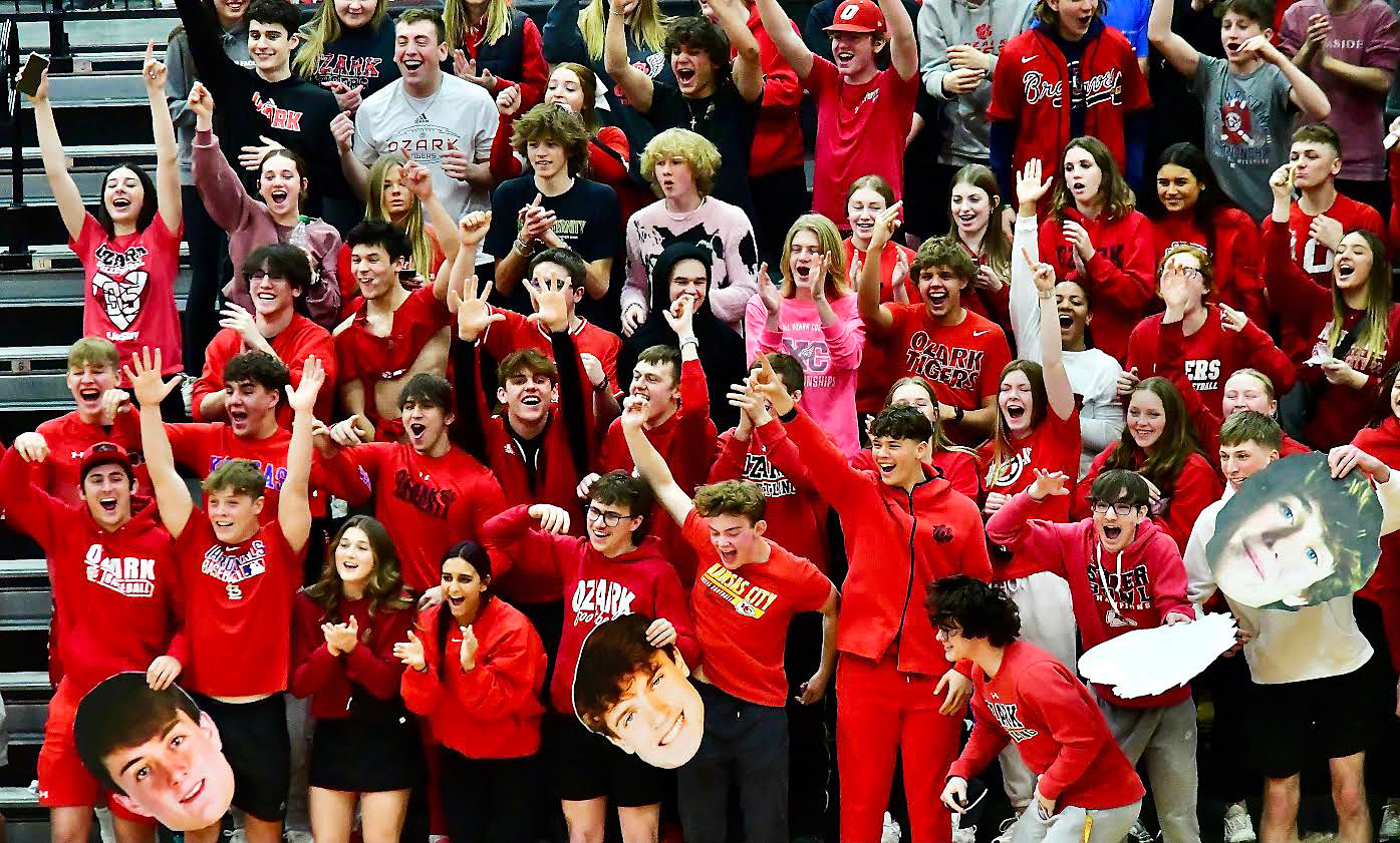 OZARK'S STUDENT SECTION cheers on the Tigers.