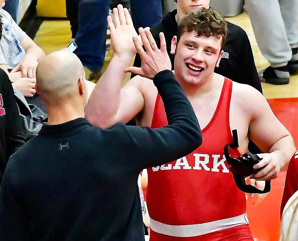 OZARK'S PEYTON GREER shares a high-five.