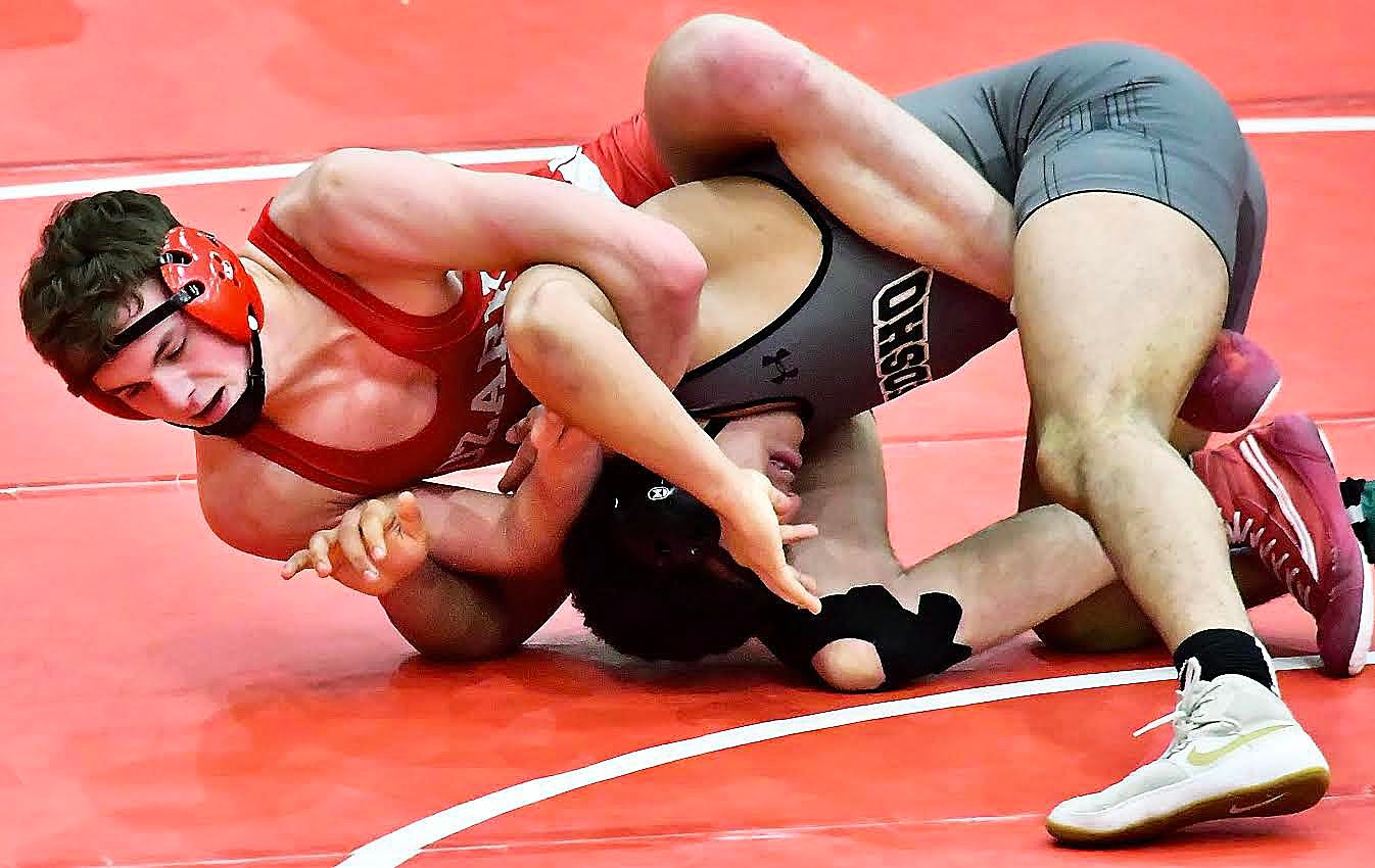 OZARK'S JOHNNY WILLIAMS fights for position.