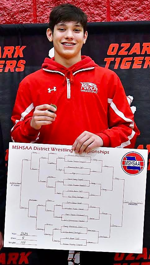 NIXA'S CURTIS GLOSSIP is all smiles atop the podium.