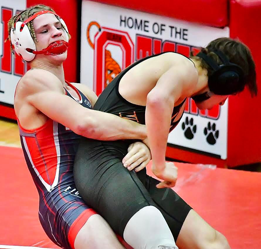NIXA;S DYLAN REBURA tries to throw an opponent.