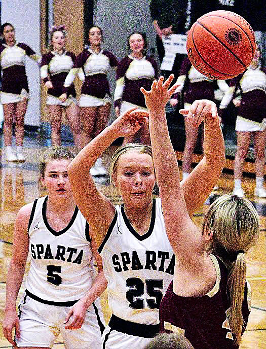 SPARTA'S NATALIE WILKS makes pass in the paint.