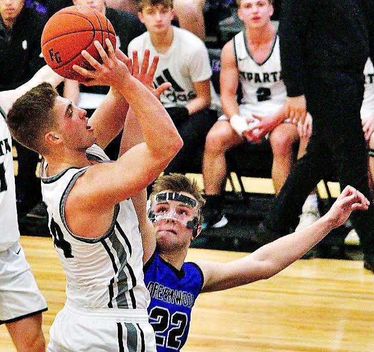 SPARTA'S DEXTER LOVELAND shoots with a hand in his face.