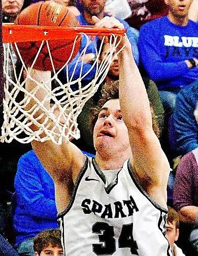 SPARTA'S JACOB LAFFERTY dunks during Wednesday's Class 3 District 11 semifinal.