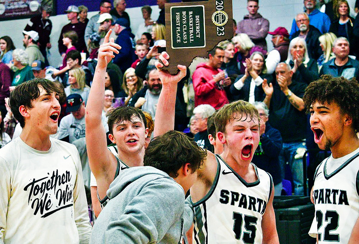 SPARTA'S KAVAN WALKER and his teammates celebrate after their win Friday.