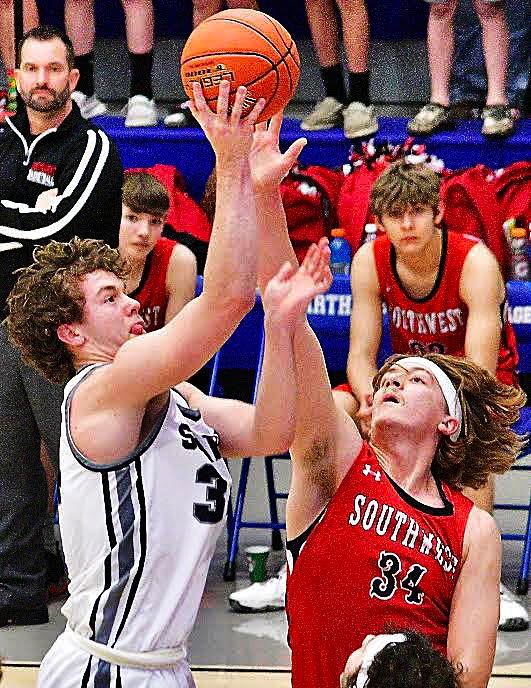 SPARTA'S JACOB LAFFERTY shoots over a defender.