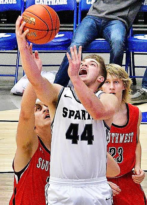 SPARTA'S DEXTER LOVELAND eyes a reverse layup.