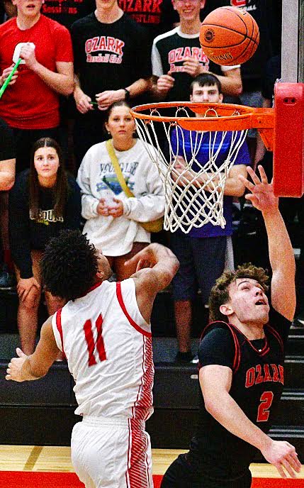 OZARK'S RYAN ENGEL eyes a layup