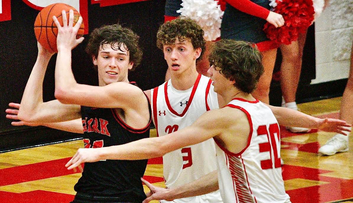 OZARK'S COHEN GEORGE posts up with the ball.
