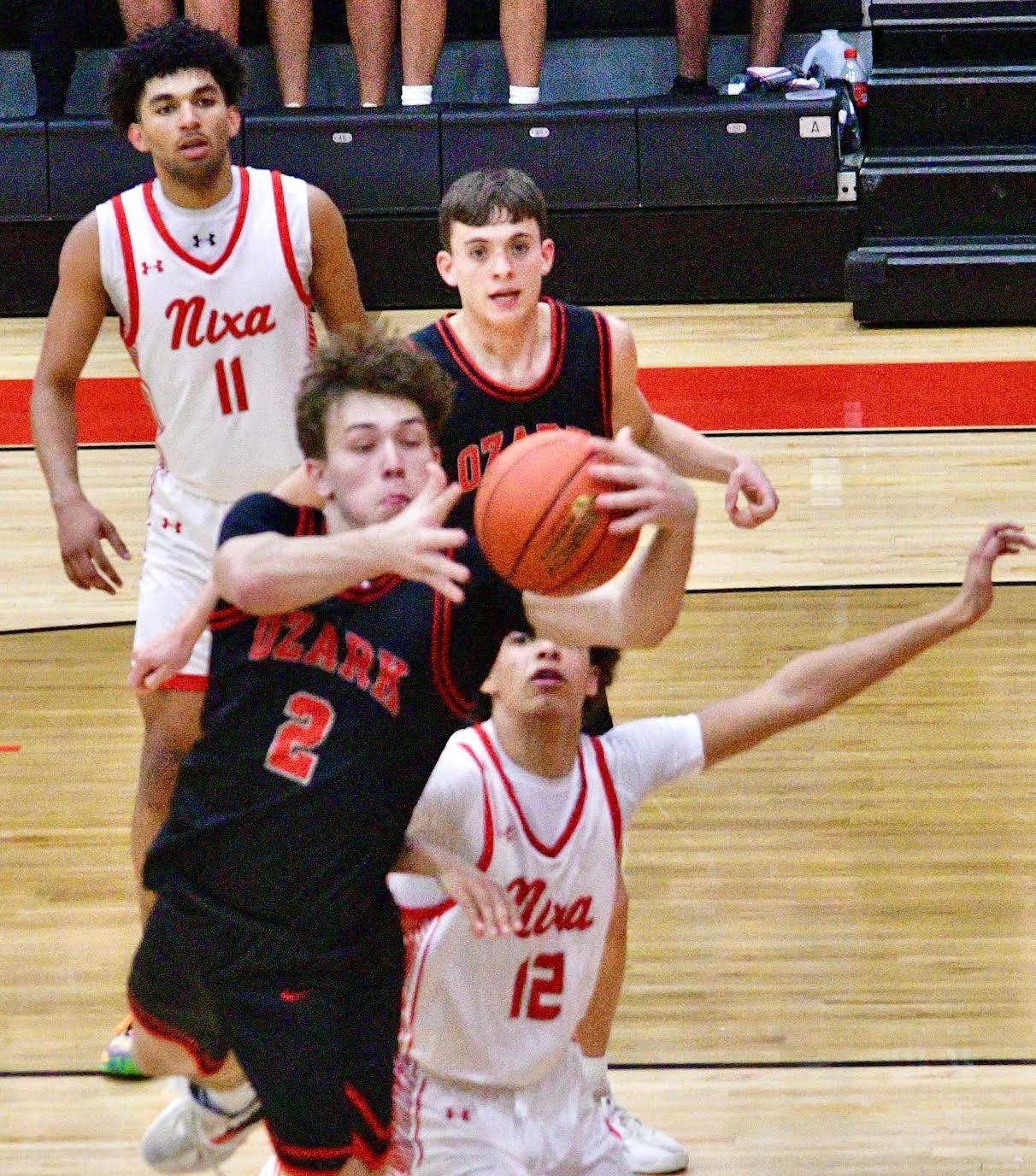 OZARK'S RYAN ENGEL grabs a rebound.