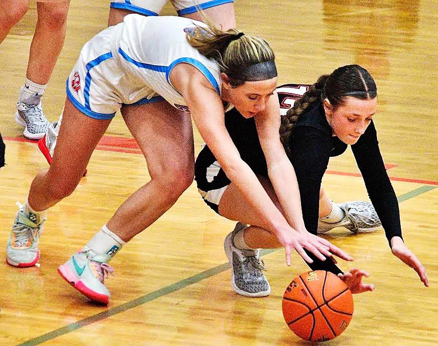OZARK'S MACEY SULT and a Glendale player hit the floor in pursuit of a loose ball.