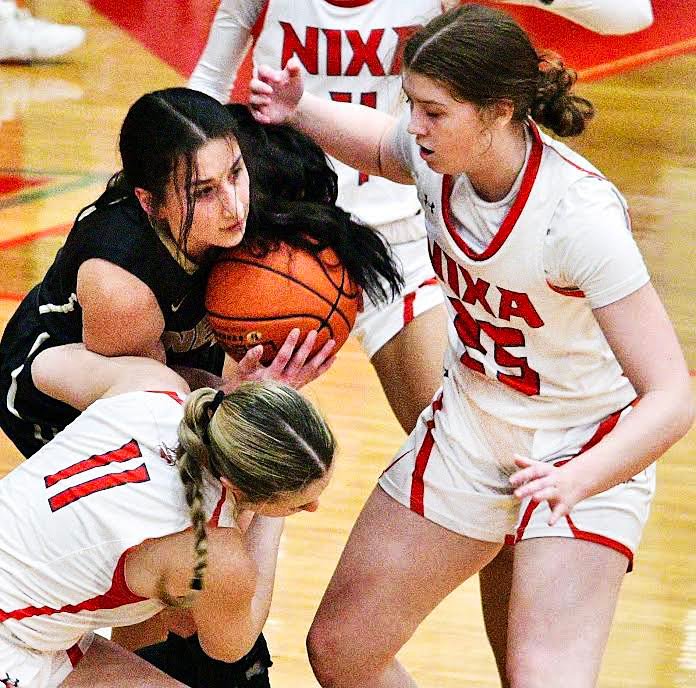 NIXA'S CAELY YOUNG looks to make a steal.