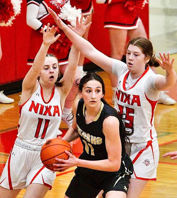 NIXA'S CAELY YOUNG AND NORAH CLARK track a Neosho ball-handler.