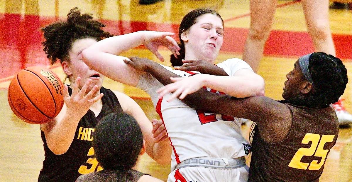 NIXA'S NORAH CLARK has the ball stripped from her grasp by a Kickapoo player in Class 6 District 5 play Saturday.