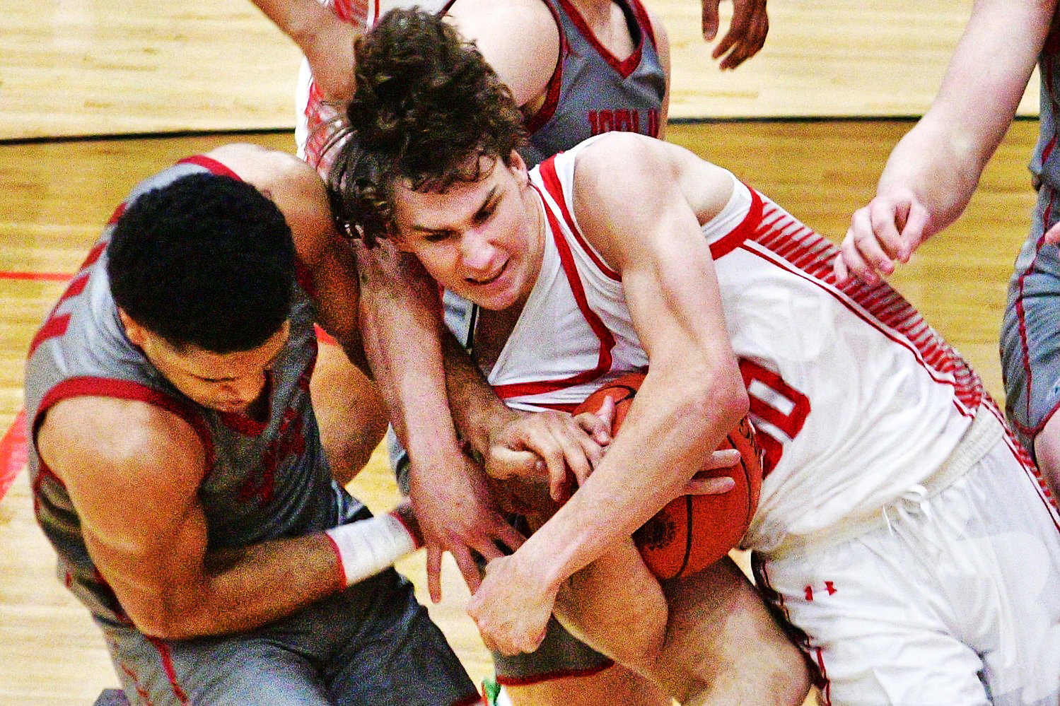 NIXA'S JOSH PETERS fights for possession of the ball against Joplin on Friday.
