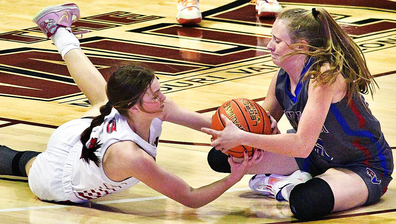 CHADWIC'S KERRIGAN GUERIN hits the floor to battle for a loose ball.