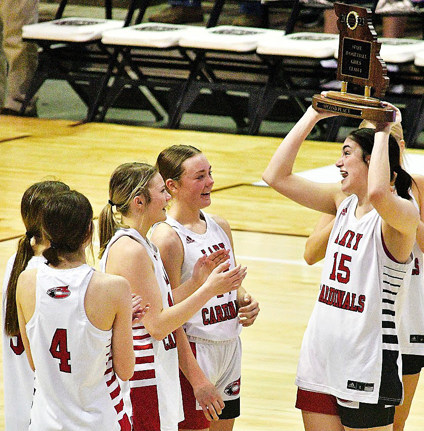 CHADWICK'S CHLOE BURKHART holds the Class 1 State runner-up trophy.