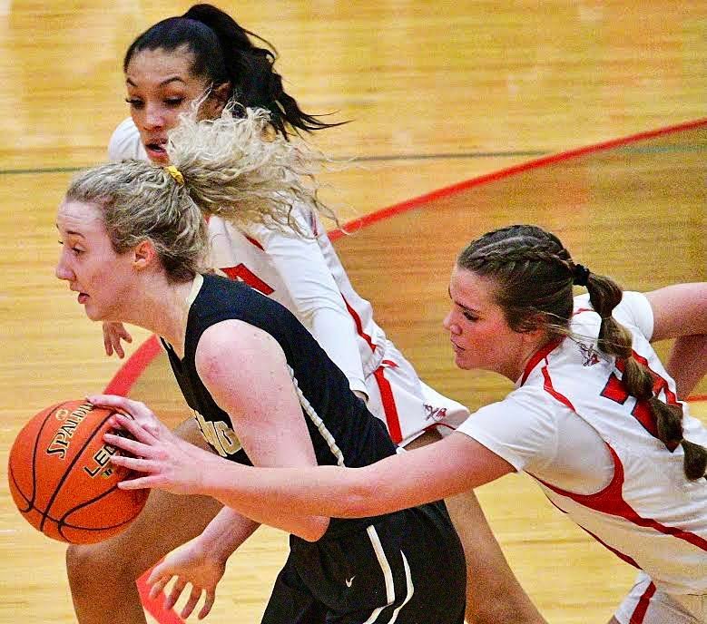 NIXA'S BROOKE TETER tries for a steal.