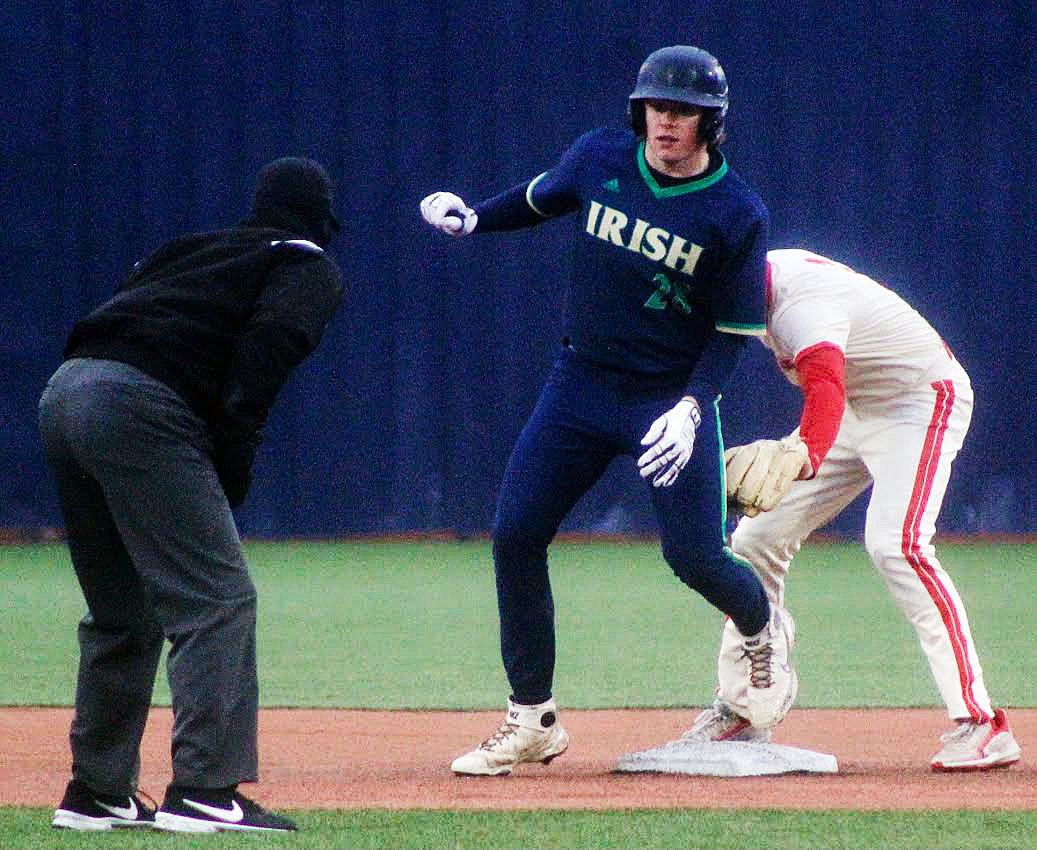 NIXA'S CAEDEN CLOUD appears to tag out a Catholic base runner at second base. The runner was called safe.