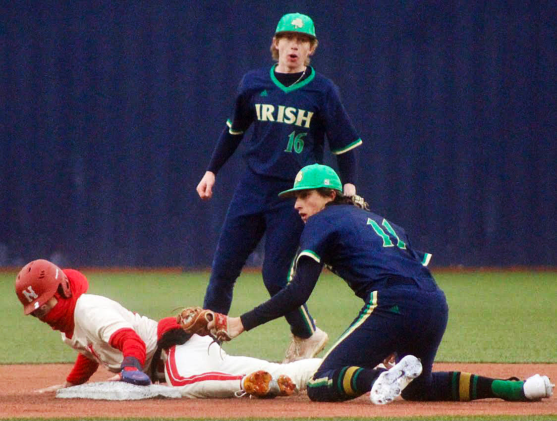 NIXA'S RYLAN MICHEL is tagged out trying to steal second base.