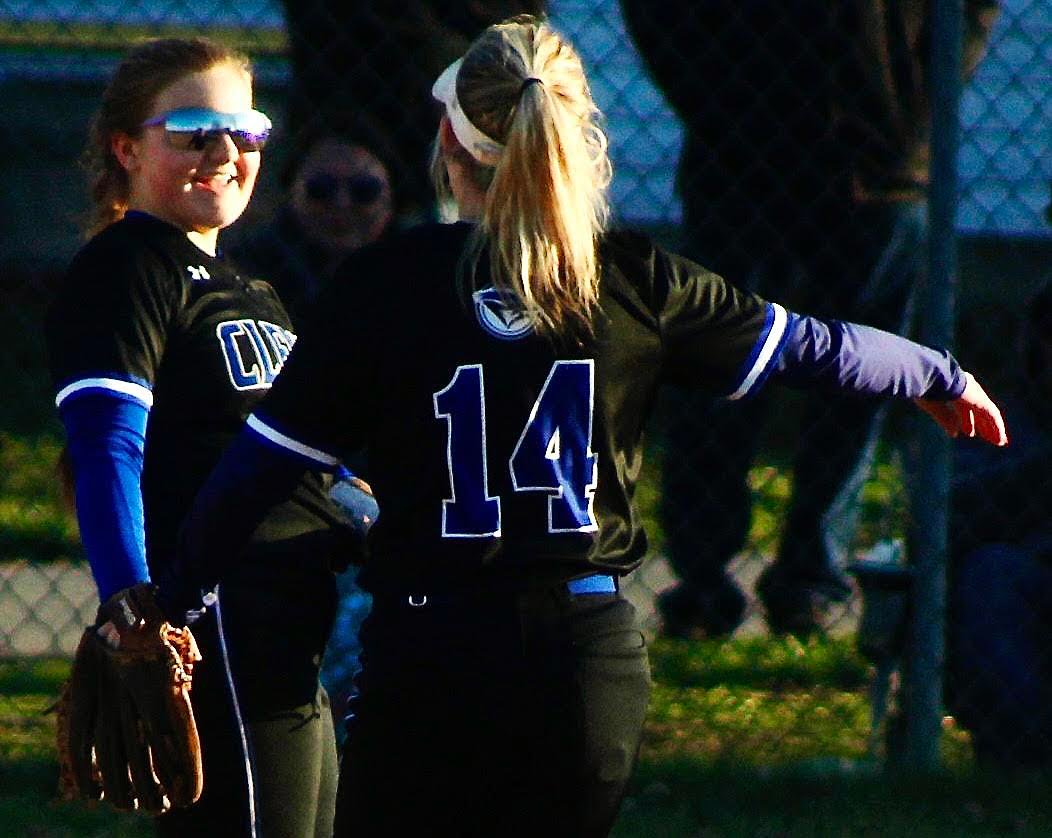 CLEVER'S RILEA KING AND CHLOE STIDHAM celebrate the Lady Jays' win at Sparta on Tuesday.