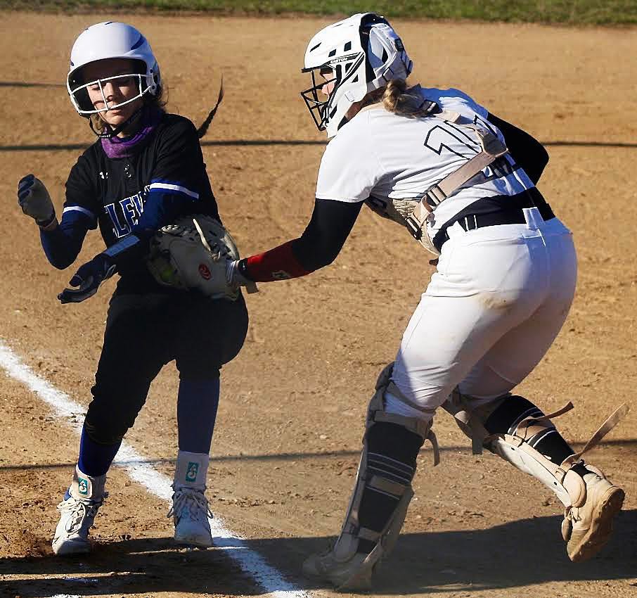 SPARTA'S MADELINE BROWN tags out a Clever baserunner at home plate.