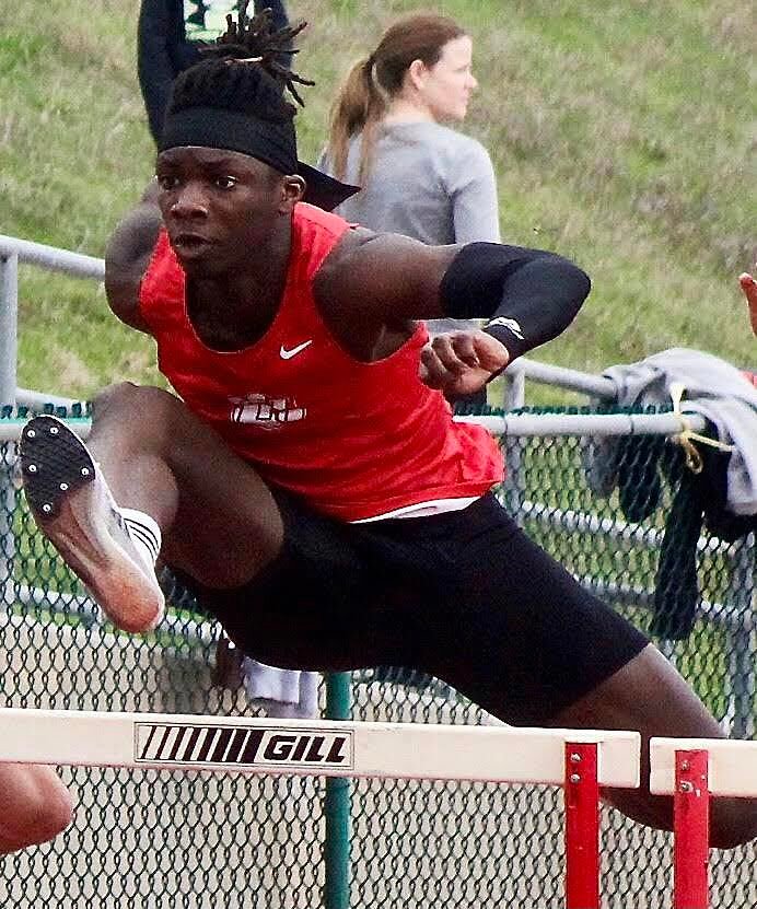 OZARK'S MAMADY EMBOLA races to a first in the 110 hurdles at the Branson Invitational.