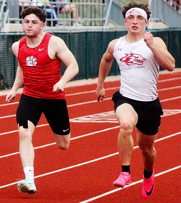 OZARK'S JACK BOWERS races to the finish in the 100.