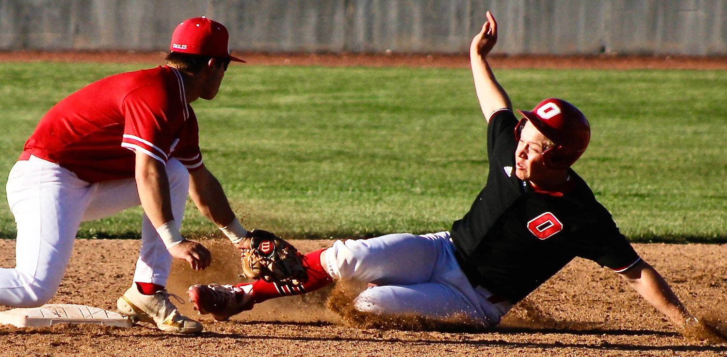 NIXA SECOND BASEMAN COLLIN USSERY tags out Ozark's Cash Morgan trying to stretch a single into a double Tuesday.