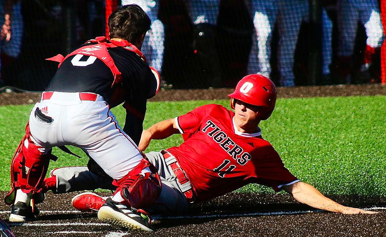 OZARK'S BROCK SUNDLIE is tagged out at home plate during the Tigers' 3-0 win at Branson on Tuesday.