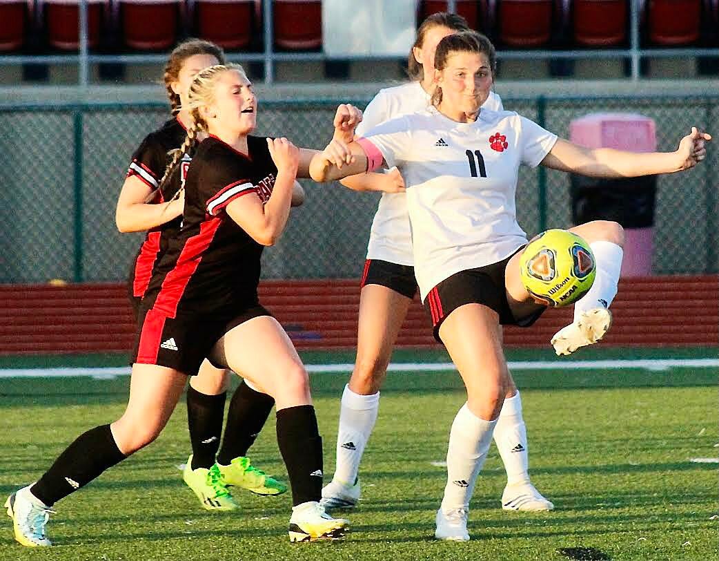OZARK'S ANNABELLE SHULER boots the ball with her left foot.