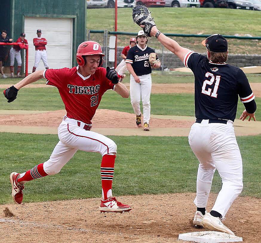 OZARK'S ALEX NIMMO races down the first-base line.